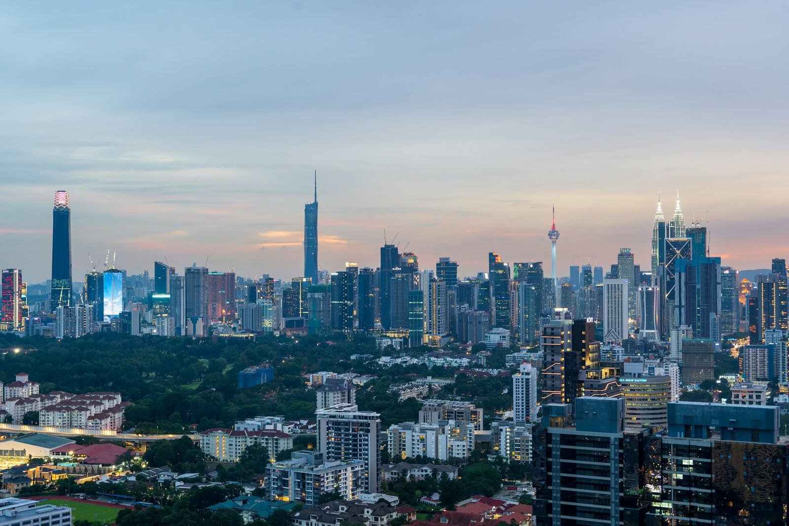 Kuala Lumpur skyline with the Petronas Twin Towers lit at dusk